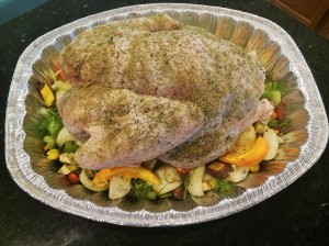 seasoned turkey in roasting pan upside down on vegetables (3)